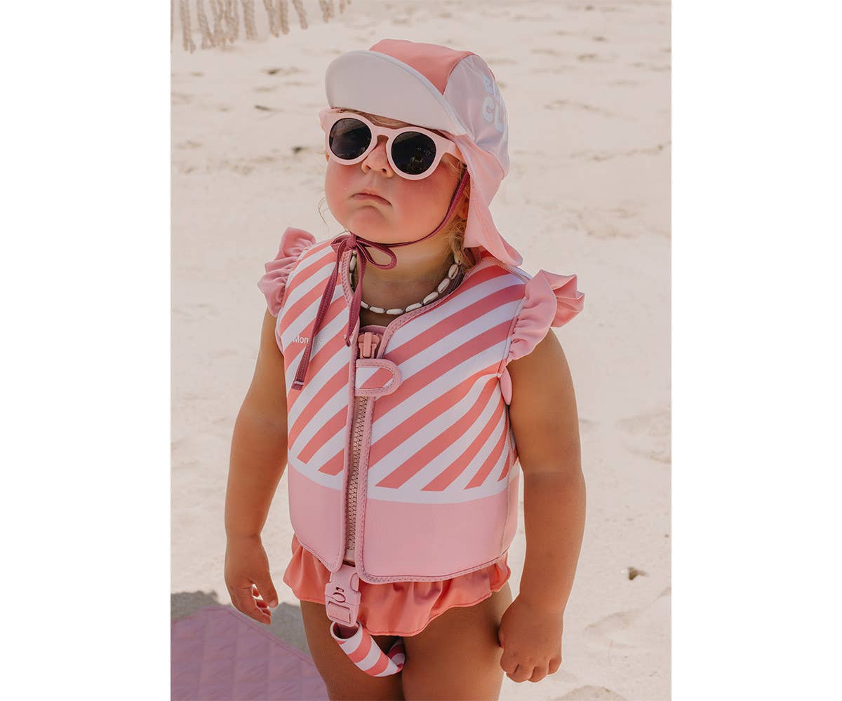 Gilet de natation Stripes Bloom & Blush Monnëka pour enfant avec éléments de flottabilité évolutifs et sangle de sécurité pour apprendre à nager.
