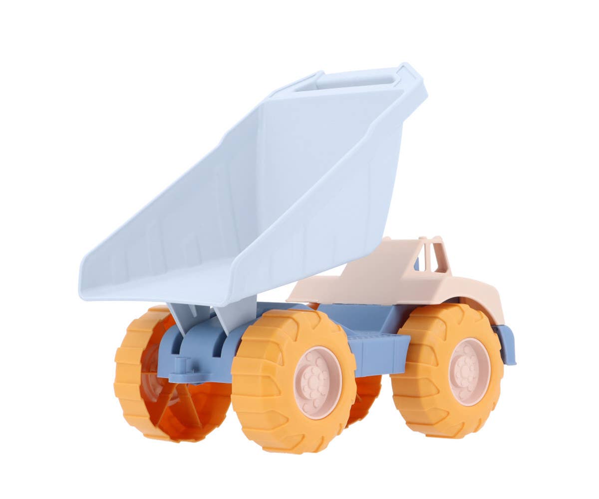 Camion Benne Bleu Monnëka avec benne basculante et roues mobiles pour enfants dès 6 mois, idéal pour jouer dans le sable et à la plage.