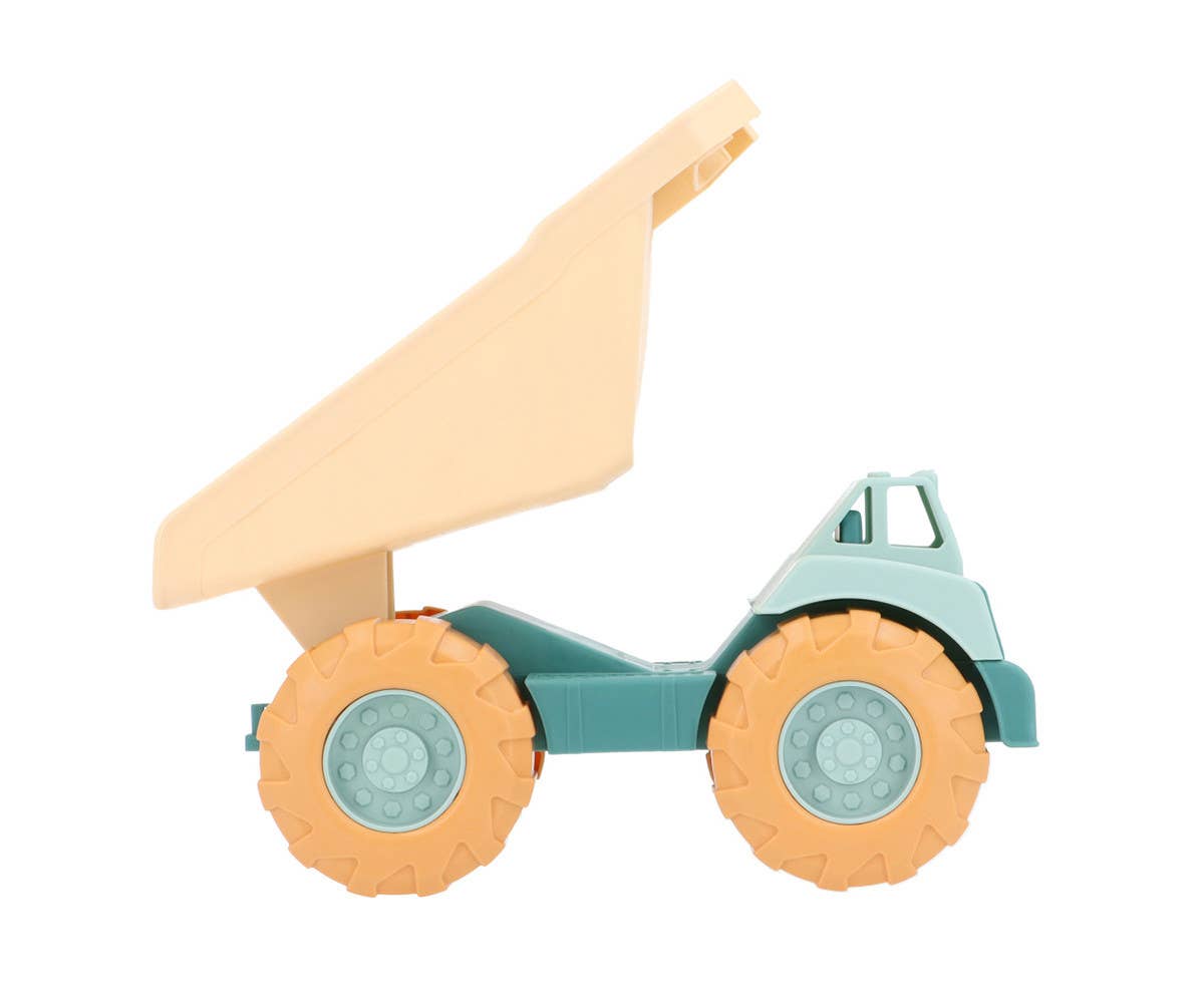Camion Benne Vert Monnëka avec benne basculante et roues mobiles pour enfants dès 6 mois, idéal pour jouer dans le sable et à la plage.