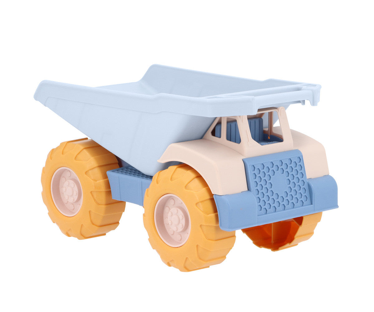 Camion Benne Bleu Monnëka avec benne basculante et roues mobiles pour enfants dès 6 mois, idéal pour jouer dans le sable et à la plage.