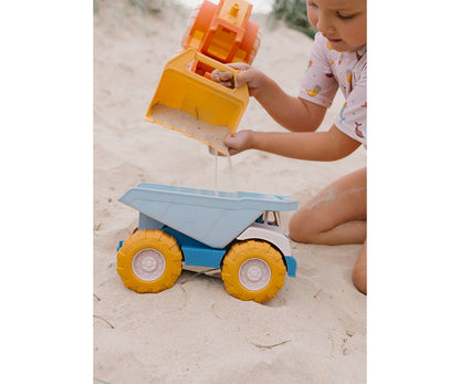 Camion Benne Bleu Monnëka avec benne basculante et roues mobiles pour enfants dès 6 mois, idéal pour jouer dans le sable et à la plage.